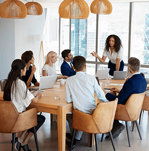 colleagues in a modern workplace setting discussing business consulting