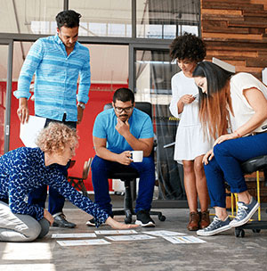 a group of consultants discussing the best change management approach