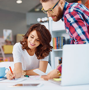consultants discussing web development services in office setting
