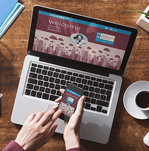 person-on-website-on-phone-and-laptop